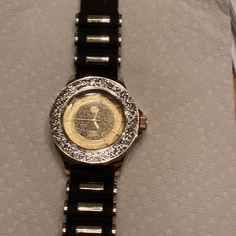 Luxurious Black and Gold Watch with Silver Details